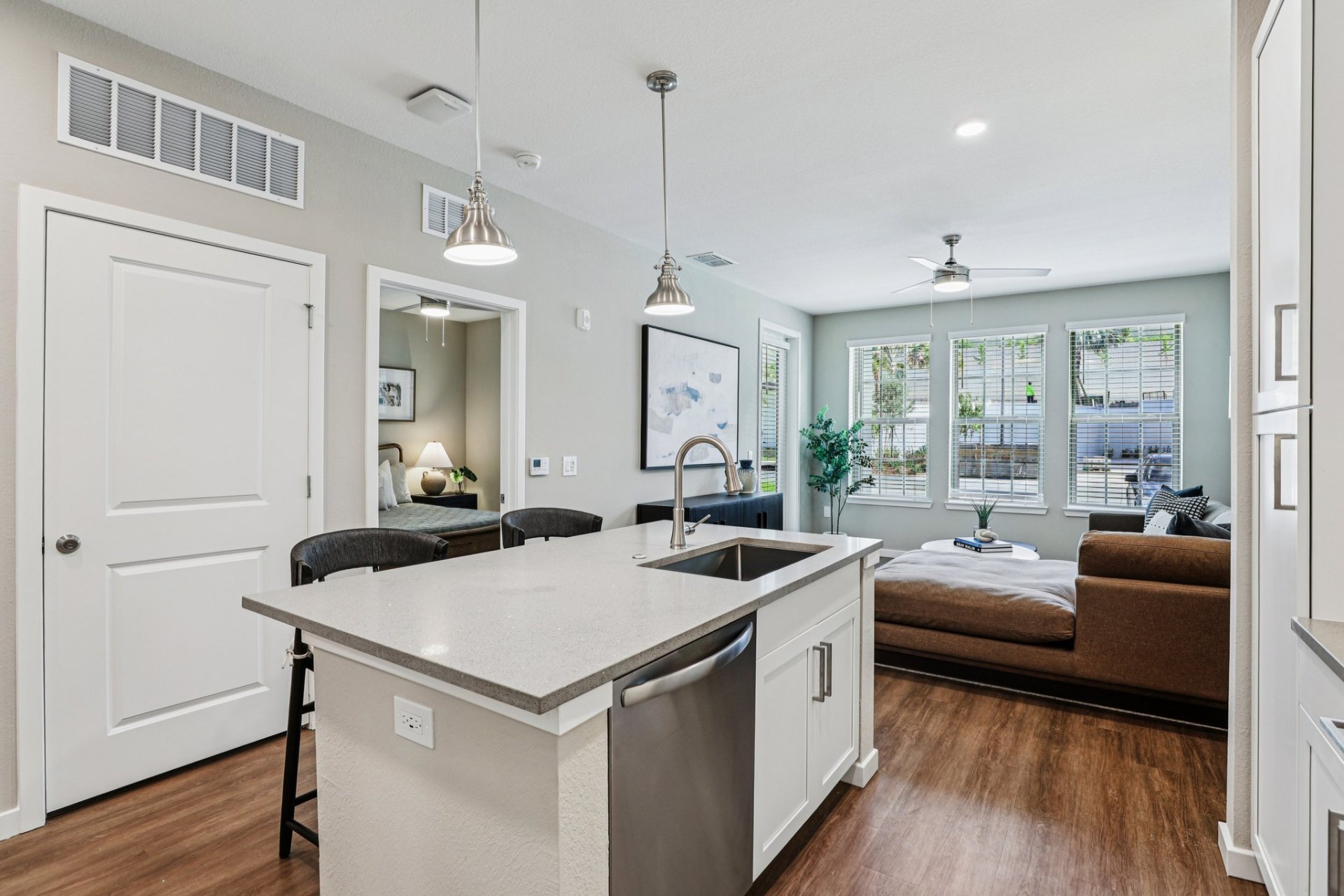 view of living room from kitchen at klara clemont apartments for rent
